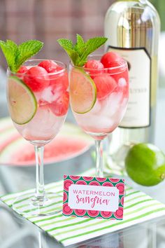 two wine glasses filled with watermelon and lime