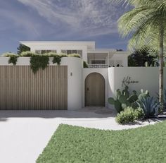 an image of a house with palm trees in the front yard and landscaping around it