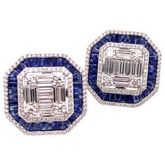 This is a stunning pair of blue sapphire and diamond earrings that has a subtle vintage appeal. It is carefully crafted with round brilliant and baguette diamonds that form the foundation of the earring while the blue sapphire is carefully placed to give a stunning accent. These straight post earrings will be a major hit at your next luncheon or social event! Sapphires: 5.1 cts. Baguettes Diamonds: 3.13 cts. Round Brilliant & Baguette Cut Metal: 18k White Gold Luxury Baguette Cut Earrings For Party, Luxury Blue Diamond Earrings With Accents, Blue Diamond Earrings With Diamond Accents, Blue Diamond Earrings With Accents, Luxury Blue Diamond Earrings With Brilliant Cut, Luxury Blue Diamond Earrings, Luxury Blue Baguette Cut Earrings, Blue Baguette Diamond Earrings Fine Jewelry, Blue Diamond Earrings With Pave Setting