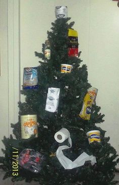 a christmas tree with toilet paper and other items on it