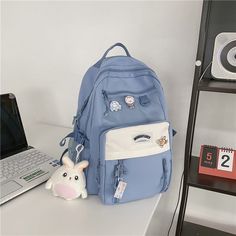 Features:

Be excited to go back to school this year with our new Multi Pockets Large Capacity Nylon Backpacks

Made with the most durable and waterproof nylon material, perfect for everyday use. Wear this as an adorable shoulder bag or backpack! 
Comes in 5 beautiful colors and adorable pins and a keychain to easily complement any of your cute school uniform/outfits 
Dimensions: 43cm x 32cm x 11cm Cute School Uniform Outfits, Stylish College Bags, Cute School Uniform, Girly Backpacks, Vestidos Anime, Uniform Outfits, School Uniform Outfits, Go Back To School, College Bags