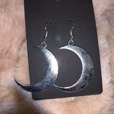 Silver moon earrings Crescent Moon Charm Jewelry For Parties, Crescent Moon Charm Party Jewelry, Crescent Moon Phase Jewelry For Party, Elegant Half Moon Metal Earrings, Silver Moon-shaped Jewelry For Party, Silver Moon Shaped Jewelry For Party, Silver Moon-shaped Party Jewelry, Metal Moon-shaped Hoop Earrings, Silver Moon-shaped Metal Hoop Earrings