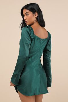 You'll be destined for fabulousness when you slip into the Lulus Sensational Fate Emerald Green Satin Cowl Neck Mini Dress for a night of drinks and dancing! Luxe stretch-woven satin shapes this effortlessly chic dress that features a flirty cowl neckline and long sleeves with elastic at the shoulders and unique flaring cuffs. The figure-skimming silhouette continues down to a subtle A-line skirt that ends at a cute mini hem. Hidden back zipper/clasp. Fit: This garment fits true to size. Length: Fitted Satin Finish Cocktail Dress, Ruched Satin Mini Dress With Square Neck, Fitted Satin Finish Dress, Ruched Satin Stretch Dress, Stretch Satin Dress With Ruched Details, Ruched Stretch Satin Dress, Glamorous Fitted Mini Dress With Satin Finish, Glamorous Satin Mini Dress For Holidays, Glamorous Fitted Satin Cocktail Dress