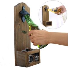 a person opening a bottle opener on top of a wooden box