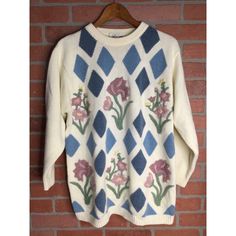 Features: * Vintage Alfred Dunner Women's Knitted Sweater * Super Soft * Oversized * Argyle Floral Pattern * Size Medium * Sweater * Fall, Winter * Floral * Made in Hong Kong * Embroidered * Crew Neck * Long Sleeve * Ribbed Neckline, Cuffs, and Hemline * 80% Acrylic, 20% Nylon * Made in Hong Kong Size: Womens M Condition: Pre-Owned Spring Crew Neck Sweater With Fair Isle Pattern, Spring Fair Isle Crew Neck Sweater, Vintage Cotton Sweater With Fair Isle Pattern, Vintage Cotton Fair Isle Sweater, Bohemian Crew Neck Knit Sweater, Bohemian Fair Isle Sweater For Spring, Bohemian Sweater With Textured Knit And Crew Neck, Bohemian Crew Neck Sweater With Textured Knit, Bohemian Textured Knit Sweater With Crew Neck