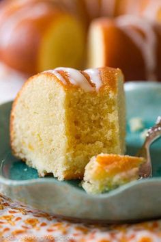 a close up of a slice of cake on a plate with a fork in it