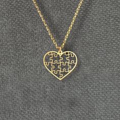 This heart puzzle necklace is a perfect symbol of love and connection. The intricately designed puzzle pieces form a beautiful heart, making it a unique and meaningful gift for couples, puzzle enthusiasts, or anyone looking for a thoughtful present. Available in both silver and gold, this necklace adds a personalized touch to any outfit and is ideal for special occasions such as anniversaries, Valentine's Day, or birthdays. Our Handmade Silver Necklaces - The Perfect Delicate Gift for You Materials: -Premium 925 Sterling Silver -18k Gold Plated Sterling Silver -18k Rose Gold Plated Sterling Silver Available Colors: -Gold -Rose Gold -Silver Choose your desired color from the options available. Packaging:  -Every necklace is carefully packaged in a special gift box, perfect for giving or tre Couples Puzzle, Necklace For Couples, Puzzle Necklace, Heart Puzzle, Gift For Couples, Puzzle Piece, Pendant Silver, Beautiful Heart, Love Symbols