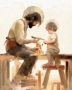 a man and child sitting at a table working on something