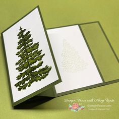 an open card with a pine tree on it