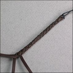 a close up of a brown leather cord