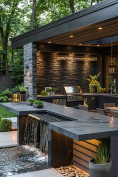 an outdoor kitchen with a waterfall in the center