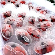 plastic containers filled with food sitting on top of ice