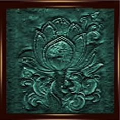 an intricately designed wall panel in green with gold trimmings and ornate designs