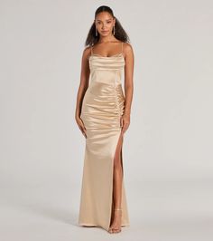 Simply stunning and beautiful is how you'll feel in the Jazmine satin formal dress perfect for weddings, bridesmaids, or fancy soirees! Made from a silky satin fabric, this gown offers a luxurious shine and sultriness to your evening look. She boasts delicate spaghetti straps and a cowl neckline, a flattering A-line silhouette designed with a front ruched seam atop a sexy high slit, and is finished with a floor-length hem. Complete the look with heels and sparkly earrings.Fit & FeaturesSatin Latte Bridesmaid Dresses, Gold Long Dress, Homecoming Inspo, Orange Homecoming Dresses, Purple Homecoming Dress, Backless Dress Short, Satin Formal Dress, Satin Bodycon Dress, Green Homecoming Dresses