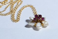 This so feminine jewelry set earrings and pendant Japanese blossom cherry. Craft from natural Keshi Pearl and Rhodolite Garnet wire wrapped 14K gold filled size of this flower 18mm, chain 20 inch secured with trigger clasp earrings : 1 inch with tulip leverback earwire Gold 14/20 New set come in jewelry box. Any question please convo with me, Custom order available ( may be other stone ? I will glad do it for you:-) Thank you for visit my shop Flower-shaped Pearl Pendant Jewelry For Wedding, White Flower Pendant Jewelry With Birthstone, Floral Pearl Pendant Jewelry For Weddings, White Birthstone Flower Pendant Jewelry, Flower Shaped Pearl Drop Jewelry As Gift, White Pearl Drop Flower Pendant Jewelry, Flower-shaped Pearl Drop Jewelry Gift, Flower Shaped Pearl Drop Jewelry Gift, Flower Shape Pearl Drop Jewelry For Gifts