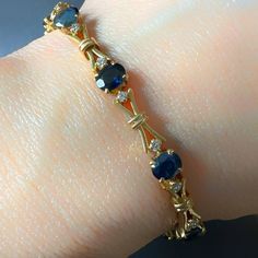 Oval Sapphire & Diamond XOXO Link Vintage Bracelet 18K Yellow Gold Blue Sapphire 4.20Ct Diamond G/H Color VS 0.40Ct 8.9gm 7.25" Long Thank you for visiting our shop! Visit our website DmKJewelry.com Also Follow us on Instagram https://www.instagram.com/dmkjewelry_/ Luxury Yellow Gold Sapphire Tennis Bracelet, Oval Sapphire Tennis Bracelet With 17 Jewels, Blue Oval Diamond Bracelet With Jewels, Oval Sapphire Diamond Bracelet, Luxury Blue Oval Diamond Bracelet, Sapphire Gemstone Tennis Bracelet With Oval Shape, Oval Sapphire Gemstone Tennis Bracelet, Blue Oval Sapphire Diamond Bracelet, Formal Blue Oval Diamond Bracelet