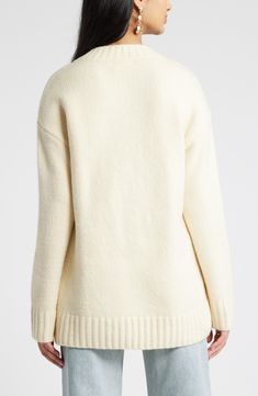 A scooped V-neck gives a graceful look to this sumptuous sweater that's just in time for the layering seasons. V-neck Long sleeves Ribbed cuffs and hem 40% nylon, 36% acrylic, 20% cotton, 4% spandex Hand wash, dry flat Imported Cream Sweater For Layering, Classic Cream V-neck Sweater For Fall, Cream Sweater With Ribbed Neckline For Winter, White Sweater With Ribbed Neckline, Elegant Cream V-neck Sweater For Fall, Off White Layering Sweater, Classic White V-neck Sweater For Fall, Cream Turtleneck Cardigan, Winter White V-neck Sweater For Layering