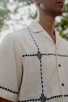 Sunlit squaresthe squares, a window to the afternoon sun, casting beautiful gentle patterns on this breathable cotton shirt Detail: Suf embroidery in beautiful squares throughout the shirt Color: Natural white kala cotton Fabric: Hand woven 1 by 1 kala cotton Fit: Leisure Fit Care Instructions: Hand wash and cool rinse. Drip dry in shade and steam/iron on the reverse side to preserve the fabric’s natural texture and sheen Model Information: Gopi is 5'10 and he is wearing a size Medium shirt Wear Traditional Embroidered Linen Shirt, White Summer Shirt With Chikankari Embroidery, Traditional Linen Tops With Chikankari Embroidery, Traditional White Linen Shirt, White Cotton Shirt With Chikankari Embroidery, White Cotton Chikankari Embroidered Shirt, Summer Long Sleeve Kurta With Motifs, Summer Cotton Kurta With Woven Motifs, Traditional Summer Kurta With Woven Motifs