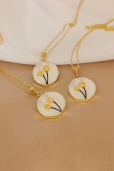 "✓ Personalized Flower Of Hair Keepsake Necklace For Women, Our Solid 925 Sterling Silver necklace with %100 hand crafted, gold workmanship is specially produced for you, Jewelry made with love for your special occasions. ---● N E C K L A C E  ∙  D E T A I L S ●--- * Pendant Diameter: 20 mm * The Chain and Pendant of the Necklace is SOLID 925 STERLING SILVER. * The pendant is made of UV stable resin. And your hair will be safe in it. * I can engrave any initial, name or numeral you want on the b Elegant Memorial Jewelry With Flower Charm, Elegant Necklace With Pressed Flowers For Anniversary, Elegant Flower Pendant Jewelry With Pressed Flowers, Elegant Pressed Flowers Jewelry With Flower Pendant, Elegant Pressed Flower Pendant Jewelry, Elegant Yellow Gold Jewelry With Pressed Flowers, Elegant Pressed Flowers Necklace For Anniversary, Gold Hypoallergenic Necklace With Flower Pendant, Gold Hypoallergenic Flower Pendant Necklace