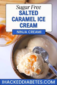 a bowl filled with ice cream sitting on top of a white table next to orange sauce