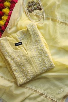 Nibs Tog Yellow Roohani Mulmul Chikankari Kurta Dupatta Set (Customizable) Step into the magic of Lemon Yellow Mulmul Chikankari Kurta with Dupatta Set. Immerse yourself in: Inspiration:  Crafted with inspiration from traditional elegance and modern trends. Creation Process:  Meticulously hand-dyed, embroidered, and adorned with pearls for a unique touch. Versatile Use:  Perfect for festivals, weddings, Haldi ceremonies, and special occasions. Benefits: -Comfortable and soft fabric -Customizable to express your style -Handcrafted for a unique touch -Embellished with Pearls detailing -Kurta Length: 50 Inches(Can be altered) Customization Options: Option 1: Semi Stitched Kurta+ Dupatta Option 2: Stitched Kurta + Dupatta Option 3: Stitched Kurta+ Dupatta+ Leggings(Soft Lycra fabric Ankle leng Esty Shop.com Clothes, Lemon Yellow Kurti, Yellow Chikankari Suit, Chikankari Kurta With Dupatta, Yellow Chikankari Kurta, Mulmul Kurta, Chikankari Kurta Set, Kamiz Design, Kurta With Dupatta