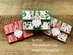 four christmas cards made with stampin's santa clauss and snowflakes