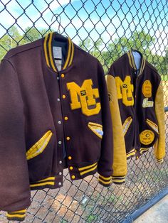 "These 1980's Letterman jackets are so cool! One of these is a baseball state champ jacket and the other has a few less patches. Here are the measurements and descriptions for both: Cloth Sleeve Letterman Jacket: Shoulders: 19 inches Chest: 44 inches Waist: 42 inches Shoulders to Hem: 25 inches This jacket is the one on the left in pictures. It has cloth sleeves and a few less patches than the State Champion jacket. It has a plain back with no writing on the back. This jacket is closest to a lar 70s Letterman Jacket, Fall Outerwear With Logo Patch And Baseball Collar, Cotton Varsity Jacket With Logo Patch And Baseball Collar, College Cotton Varsity Jacket With Logo Patch, Cotton Varsity Jacket With Logo Patch, Sporty Cotton Varsity Jacket With Logo Patch, Collegiate Cotton Outerwear With Letter Patch, Varsity Outerwear With Logo Patch For Fall, Fall Varsity Outerwear With Logo Patch