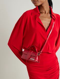 Jacquemus is  the  arbiter of micro bags - the smaller, the chicer. Nodding to Y2K with a hint of the '50s, this 'Le Bambino' tote is made from leather in a slim, rigid silhouette with a ladylike top handle. It'll hold a smartphone, keys and a cardholder. Mini Jacquemus, Jacquemus Bag, Micro Bags, Flat Dress Shoes, Dresses And Shoes, Dress Flats, Red Purses, Red Outfit, Cute Bags