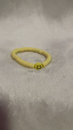 This is a homemade bracelet. With yellow, and a yellow smiley face in the middle you should feel happy when you wear this !! Yellow Smiley Face Beaded Bracelets For Gifts, Cheap Yellow Beaded Bracelets With Smiley Face, Adjustable Smiley Face Round Bead Jewelry, Adjustable Yellow Smiley Face Bracelet, Multicolor Smiley Face Round Beads Jewelry, Yellow Smiley Face, Homemade Bracelets, Smiley Face, Smiley