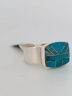 New Native American handmade sterling silver ring with turquoise and sterling intarsia design by Navajo artist Avery Norton
Buckshot Billy is a stunning Native American handmade sterling silver ring featuring a unique turquoise and sterling intarsia design.
#AveryNortonJewelry #BuckshotBillyRing #NativeAmericanJewelry #SterlingSilverRing #TurquoiseIntarsia #NavajoArt #HandmadeJewelry #ArtisanCraftsmanship #TurquoiseLovers #BohoStyle #SouthwestJewelry #UniqueRingDesign #StatementRing #LuxuryAccessories #NativeAmericanCraftsmanship #CollectibleJewelry #TurquoiseAndSilver #HandcraftedRing #BoldJewelry #NavajoJewelry #IntarsiaDesign Vintage Navajo Rings, Southwestern Polished Turquoise Ring Collectible, Sterling Silver Rings Turquoise Native American, Nickel-free Southwestern Round Turquoise Ring, Unique Ring Designs, Nickel-free Round Southwestern Turquoise Ring, Handmade Sterling Silver Rings, Southwest Jewelry, Navajo Jewelry