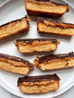 several pieces of chocolate filled pastry on a white plate