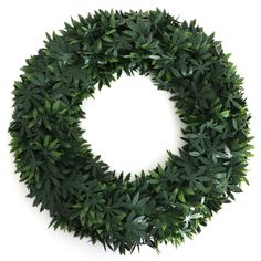 a green wreath is shown on a white background