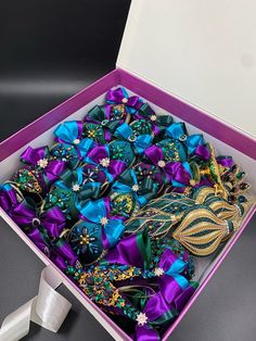 a box filled with lots of different colored ribbons