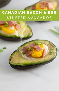 avocado halves with eggs, tomatoes, and other food items on them are shown