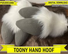 there is a stuffed animal with white fur on it's head and the words toony hand hoof