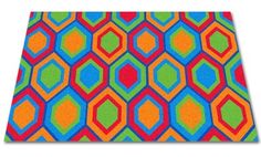 a colorful area rug with an abstract design