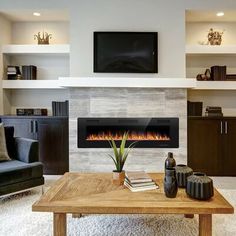 a living room with a fire place in the center