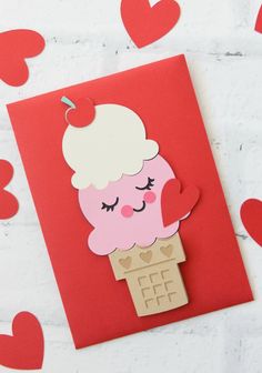 an ice cream sundae card with hearts on the wall and paper cut outs in the shape of hearts