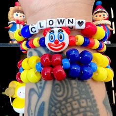 Clown kandi clowncore beaded bracelet set primary color jewelry accessories by LavenderCandyClown on Etsy Playful Plastic Jewelry With Letter Beads, Fun Plastic Beaded Bracelets With Letter Beads, Novelty Plastic Bracelets With Round Beads, Novelty Stretch Bracelet With Colorful Beads, Playful Red Jewelry With Letter Beads, Novelty Multicolor Beaded Bracelets, Fun Plastic Jewelry With Round Beads, Fun Plastic Beaded Bracelets For Birthday, Fun Beaded Plastic Jewelry