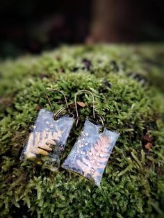 Beautiful Earrings made of genuine dry fern leaves and tiny forest flowers in a clear resin. Inspired by nature, fairytales, and forest. Magical and elegant earrings for nature lovers, bohemian and unique people. A perfect and unusual gift. Handmade Leaf-shaped Nature-inspired Earrings, Nature-inspired Dangle Earrings, Bohemian Drop Earrings With Natural Inclusions, Handmade Leaf-shaped Botanical Earrings, Nature-inspired Drop Earrings With Natural Inclusions, Handmade Botanical Leaf Earrings, Nature-inspired Dangle Earrings With Pressed Flowers, Nature-inspired Green Earrings With Pressed Flowers, Botanical Leaf-shaped Earrings With Ear Wire