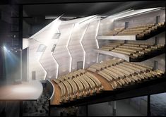 an auditorium with rows of seats and lights