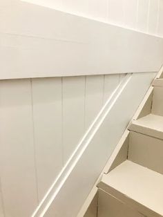 the stairs are painted white and there is no one going up them or down them