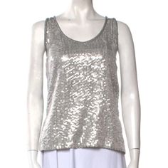 Dvf Sleeveless Sequin Top. Silver Sequined Front, Black Back, High Low Hem. Glittering Sequins Highlight This Elongated Silhouette Of Finely-Woven Silk. New With Tag Attached! Brand/Maker - Diane Von Furstenberg Style - Scoop Neck Sleeveless Top Name - Desta Size On Tag - 8 Shoulder - N/A Sleeve (Shoulder To Cuff) - N/A Sleeve (Underarm To Cuff) - N/A Chest (Pit-To-Pit) - 17.5“ Waist - 18.5“ Length - 24“ Color - Black/Silver Material - 100% Polyester. Condition - Mint Nwt Condition; No Flaws Mad Silver Sequined Tank Top For Night Out, Sequined Silver Tank Top For Night Out, Sequin Silver Tank Top For Night Out, Fitted Silver Tank Top For Summer, Silver Sequined Tank Top, Glamorous Silver Sleeveless Tops, Chic Fitted Silver Tank Top, Silver Tank Top For Party, Silver Sequin Tank Top For Spring