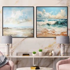 two paintings hang on the wall above a coffee table in a living room with pink chairs