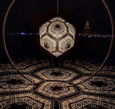 the reflection of an object in water at night