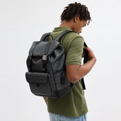 Made for a life in constant motion the League keeps your game plan on track. Crafted of our Signature canvas and refined leather this roomy backpack is a comfortable choice for every day with its padded back and straps. Organized with multiple pockets inside and out the sporty style has a dedicated laptop sleeve and plenty of space for notebooks water bottles and other essentials. An exterior zipper gives easy access to the main compartment. | Coach League Flap Backpack In Signature Canvas - Cha Luxury Coated Canvas Backpack With Large Capacity, Designer Leather Backpack With Large Capacity, Luxury Coated Canvas Leather Backpack, Luxury Large Capacity Coated Canvas Backpack, Luxury Coated Canvas Backpack For Everyday, Black Coated Canvas Backpack With Adjustable Strap, Luxury Coated Canvas Backpack For Travel, Luxury Leather Trim Standard Backpack, Designer Backpack With Leather Trim