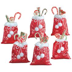 christmas bags with candy canes and candies are shown in red sequinized fabric