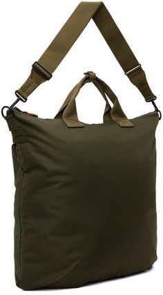 Lightweight nylon canvas tote in khaki. · Press-stud tab at webbing carry handles · Adjustable and detachable crossbody strap · Logo patch at face · Patch pockets and pleats · Zip closure · Zip pocket at interior · Fully lined · H16.5 x W18 x D2 Supplier color: Olive drab Military Style Nylon Bags For Everyday Use, Military Style Travel Bag With Adjustable Strap, Military Travel Bags With Adjustable Strap, Utility Nylon Bag With Adjustable Strap, Khaki Military Bag With Adjustable Strap, Military Style Khaki Bag With Adjustable Strap, Face Patches, Utility Tote, Press Studs