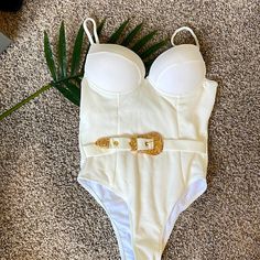 Brand New White One Piece Belted Swimsuit Perfect For Bachelorette Party! Size M Built In Cups Chic Spring Bodysuit For Beach Party, Chic One-piece Bodysuit For Beach Party, White Bodysuit For Beach Season Parties, White Summer Bodysuit For Party, White Party Bodysuit For Beach Season, Chic Fitted Bodysuit For Beach Party, White And Gold Swimsuit, Luxury White Swimming Bodysuit, White V-neck Swimwear For Pool