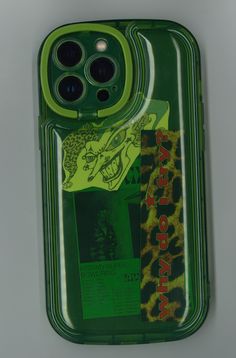 a cell phone case with an image of a leopard on the front and green background